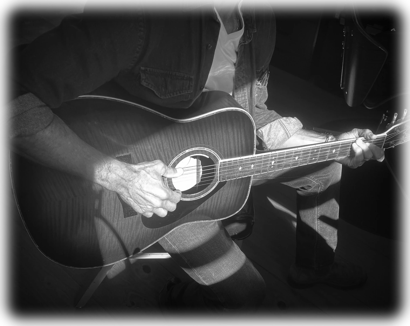 Peter playing acoustic guitar